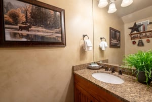 From the granite countertops to the tasteful mountain artwork, the half bathroom at Three Kings 65 reflects the refined quality in this Park City vacation rental.