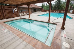 After a day on the slopes or the golf course, unwind in the yearround outdoor pool and hot tub — just one of the many perks of choosing Three Kings 65.