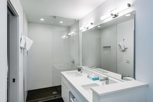 Three Kings 80 delivers a spalike experience with its immaculate allwhite bathroom featuring a double vanity and oversized walkin shower.