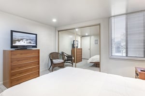 The master bedroom includes a comfortable sitting area and TV, giving everyone in your group their own space to unwind.
