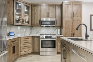 Your fully equipped kitchen features natural wood cabinetry, marble countertops, stainless steel appliances, and everything you need to prepare delicious meals during your stay.