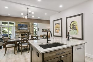 The beautifully remodeled kitchen at Powder Run C13 is a chefs dream, boasting quartz countertops, stainless steel appliances, and elegant wood cabinetry that make this Deer Valley condo rental the