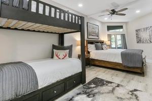 The ultimate familyfriendly bedroom at Powder Run C13 offers a fun bunk bed alongside a comfortable king bed, providing flexible sleeping arrangements that make this Deer Valley vacation rental idea