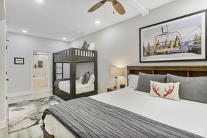 Gather the whole crew in this cozy bedroom with a king bed and bunk beds—perfect for families seeking comfort and adventure together.