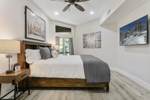 Modern, clean, and thoughtfully designed, this comfortable bedroom at Powder Run C13 offers a wallmounted smart TV and flexible sleeping arrangements.