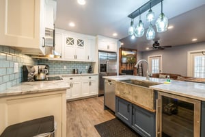 Resort Plaza 5000 features a beautifully renovated kitchen with a dramatic dark island, crisp white cabinetry, and stylish pendant lighting — a chefready Park City vacation rental setup perfect for g