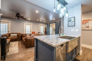 The kitchen island at Resort Plaza 5000 offers casual bar seating for the group — another reason this renovated Park City condo rental is the ideal home base for families and groups who love to cook a