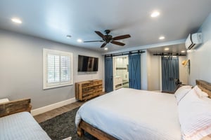 Wellappointed and welcoming, this guest bedroom at Resort Plaza 5000 offers a flatscreen TV, generous storage, and all the comforts that make this Park City condo rental a true home away from home.