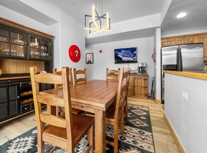 Gather around the spacious dining table where your group can share meals and stories in this bright, welcoming space. The full kitchen and modern fixtures make it easy to cook and unwind after a day o