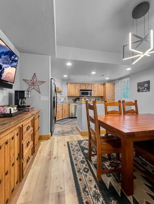 Your openconcept kitchen and dining area features warm wood tones, modern lighting, and all the space you need to prepare and enjoy memorable meals together.