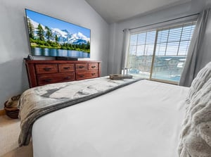 Drift off in this serene bedroom where soft linens and calming views create your personal retreat. Wake up to natural light streaming through the window, refreshed and ready for your mountain adventur