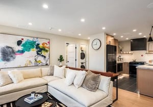 Sink into plush seating in your openconcept living space, where modern art and natural light create a welcoming retreat after exploring the area.