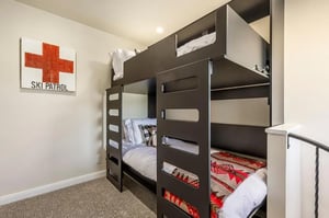 Twinovertwin bunk beds in the upstairs loft bedroom, with TV