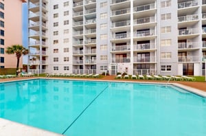 The outdoor swimming pool in front of Sunswept Condominiums