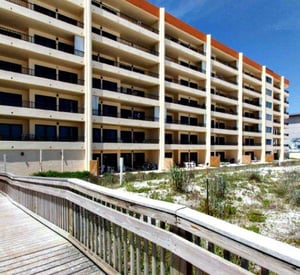 Gulfside exterior view and beach boardwalk at Surf Dweller Fort Walton Beach