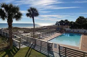 Relax by the outdoor swimming pool at SeaSpray East