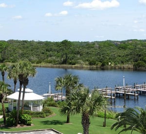 Palmdotted grounds white gazebo and boat slips at Pinnacle Port in Panama City Beach FL