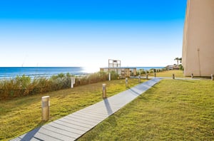 Boardwalks lead to a private beach entrance.