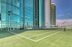 The outdoor tennis court at Turquoise Place in Orange Beach Alabama