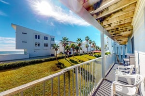 A private balcony with chairs at Seascape in Orange Beach Alabama