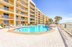 The exterior and outdoor pool at Azure Condominiums in Fort Walton Beach Florida