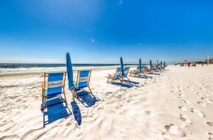 Azures blue lounge chairs and beach umbrellas
