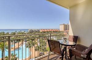 View of the pool and Gulf from a balcony