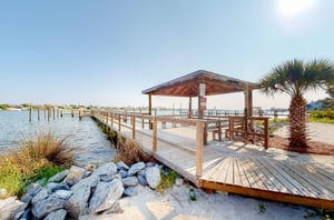 The wooden pavilion and boat dock on Ole River at Molokai Villas