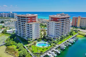 Aerial view of the two towers with a circular owners pool next to the harbor