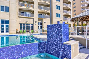 The small waterfall by the outdoor swimming pool at Escapes to the Shores