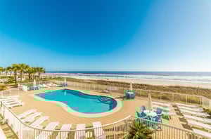 Aerial view of the outdoor pool and pool deck at Sandy Key Condos