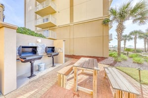 The picnic area with four stainless steel grills and tables at Sandy Key