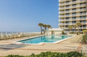 The outdoor swimming pool next to the beach at Pelican Pointe in Orange Beach Alabama