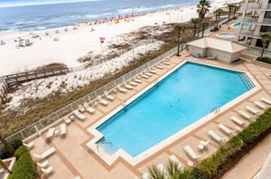 Aerial view of the outdoor pool and pool deck at Pelican Pointe in Orange Beach Alabama
