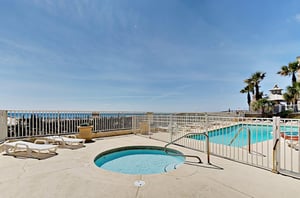 The outdoor swimming pool and kiddie pool at Four Winds in Orange Beach Alabama