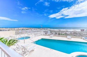 View from a balcony of the pool deck at Four Winds in Orange Beach Alabama