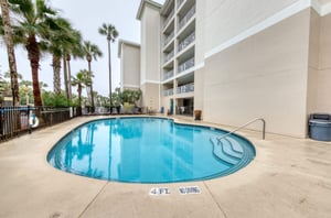 The comminity swimming pool sits ready for guests to enjoy.
