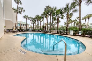 The community pool and surrounding sundeck stay ready for guests.