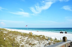 A U.S. flag flies over this pristine beach.