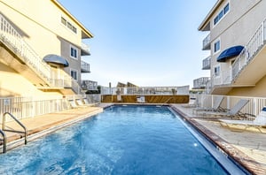 Relax by the spacious outdoor pool with Gulf views
