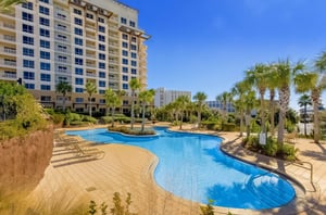 Luau Resorts shimmering aqua lagoon pool and spacious sundeck sit just next to one of the complexs two towers