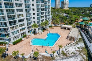 Many of the units have balconies overlooking the swimming pool.