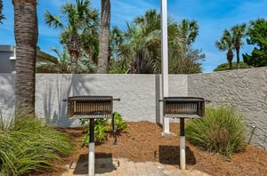 Charcoal grills stand ready for Beachside Towers guests to cook meals.