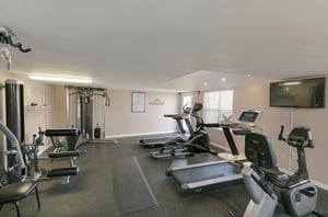 The fitness room has a variety of exercise machines to cover upper and lower body workouts, as well as a treadmill for cardio.