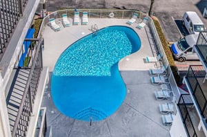 Aerial view of the outdoor pool and pool deck at Island Sunrise in Gulf Shores Alabama