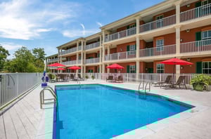 The sparkling outdoor pool in front of Water Street Hotel  Marina in Apalachicola Florida