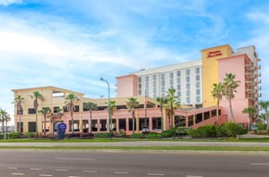Street view of the exterior of Hampton Inn  Suites and free parking garage