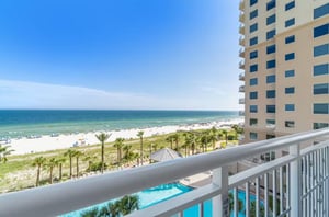 View of the outdoor pool and Gulf of Mexico from a private balcony
