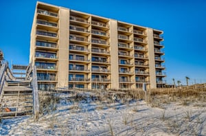 The beachfront facade of Ocean Breeze West in Perdido Key Florida