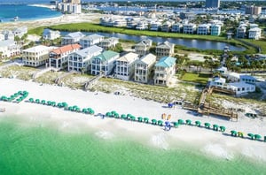 Beach lounge chairs and umbrellas are set up daily for guests to enjoy.